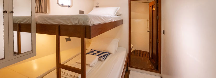 En-suite cabins with double-sized bed & bunk beds